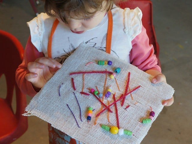 child sewing