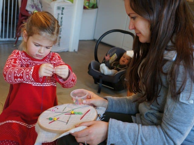 child and adult sewing