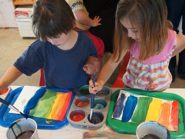 children making rainbow collages