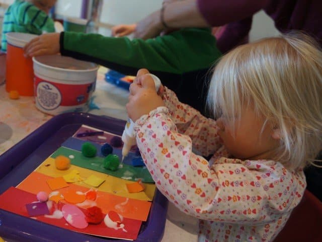 children working on rainbow art project
